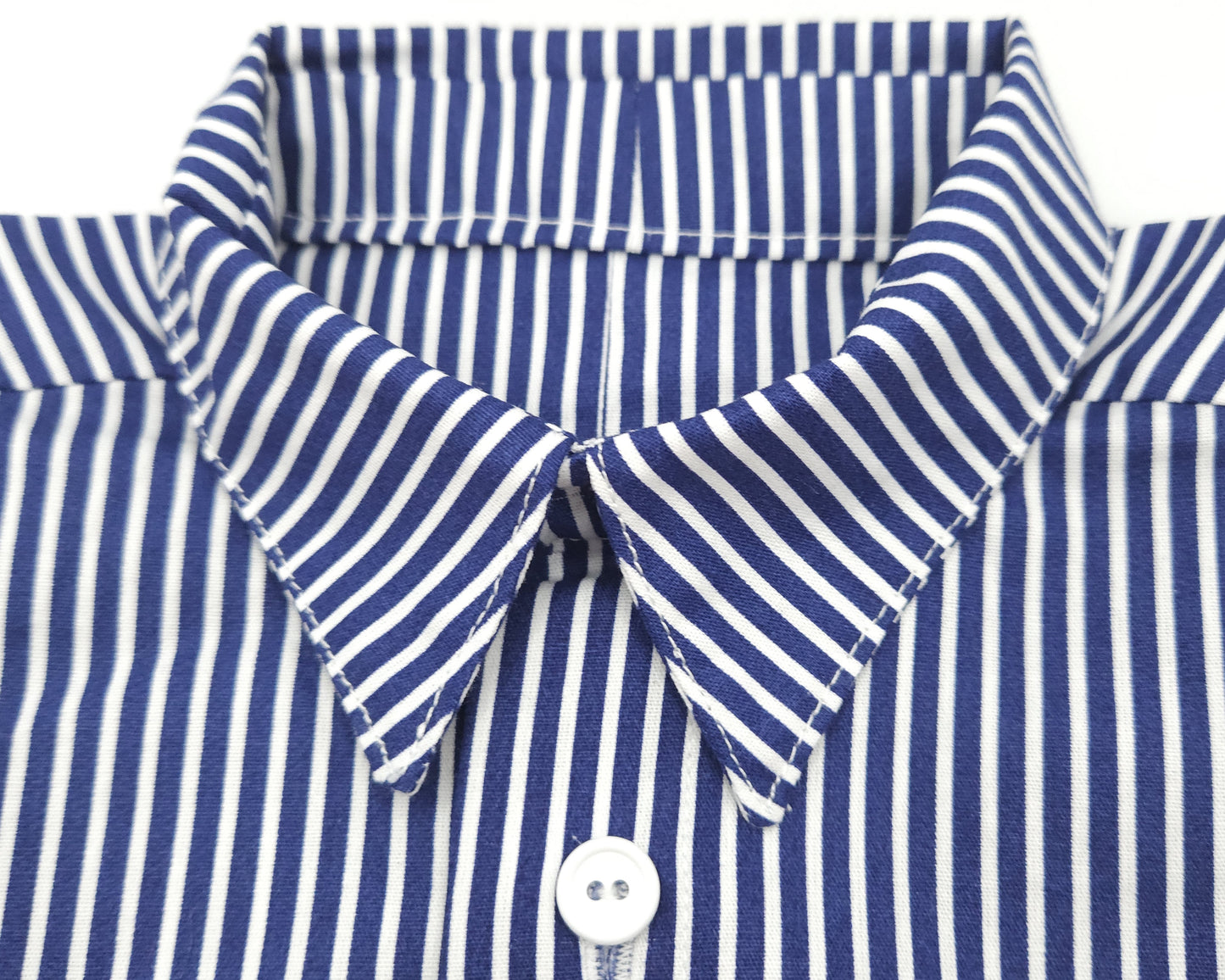 Close-up of a blue and white striped shirt collar with buttons.