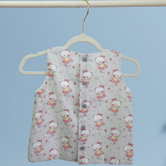 Back view of Children's sleeveless top with cartoon pattern on a hanger against a blue background