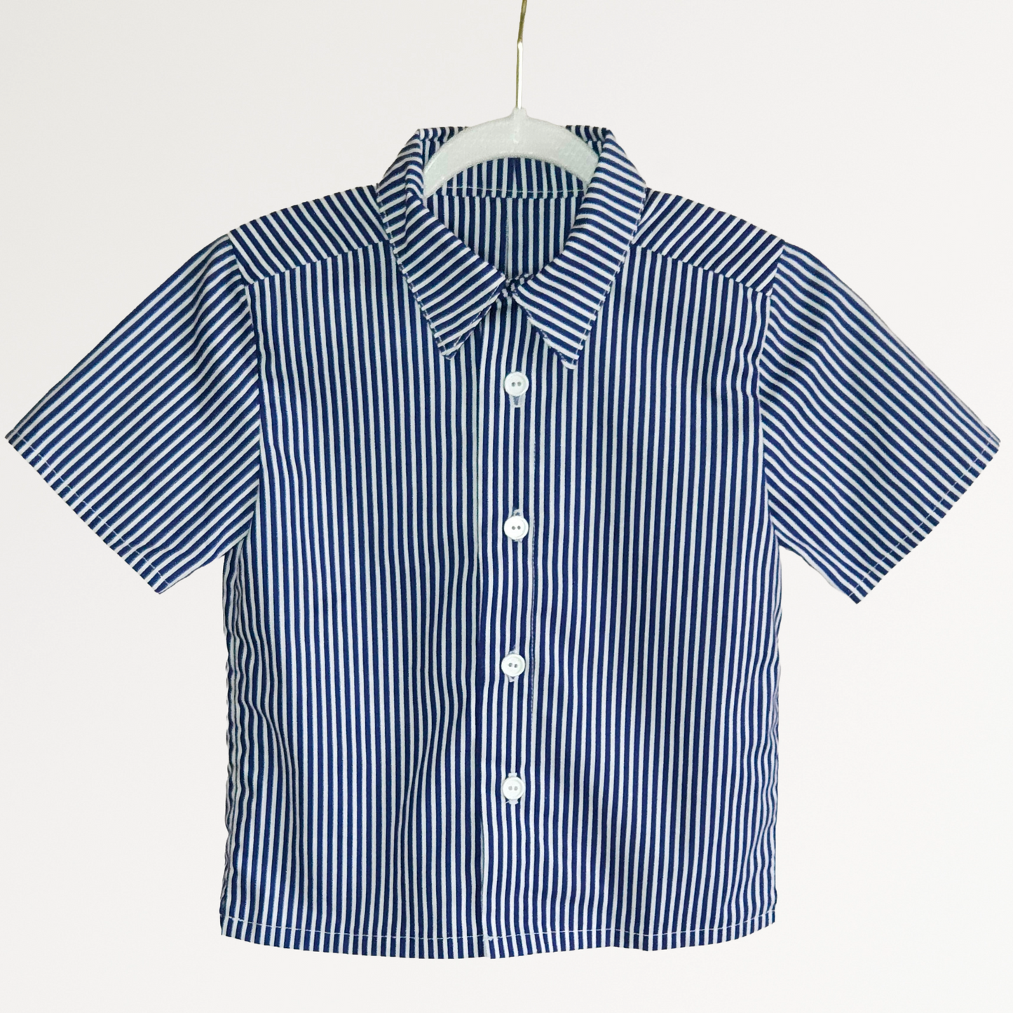 Blue and white striped shirt on a hanger against a white background