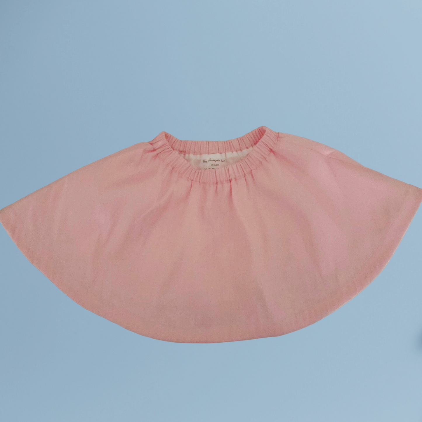 Handmade Pink taffeta skirt on a light blue background