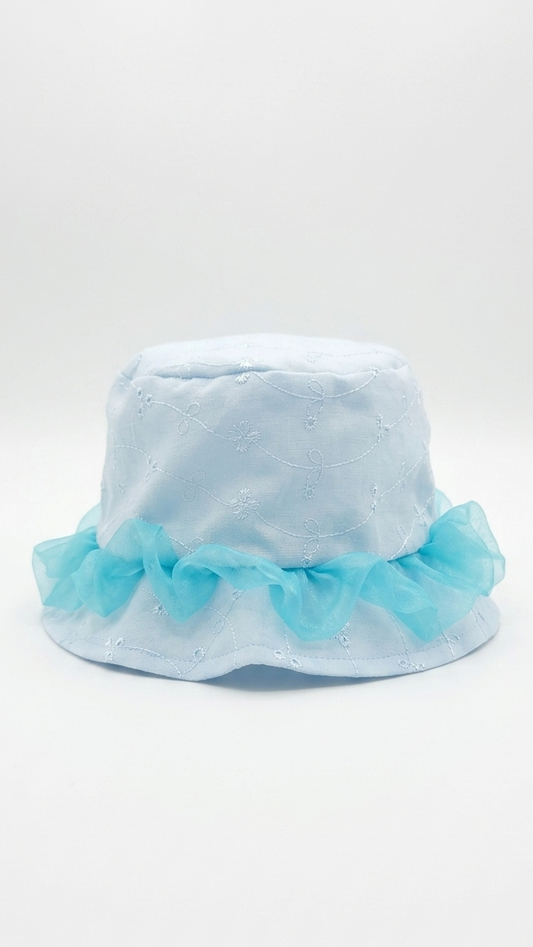 Light blue bucket hat with ruffled trim on a white background