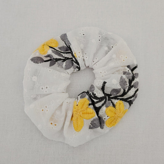 Scrunchie with yellow embodered flower design 