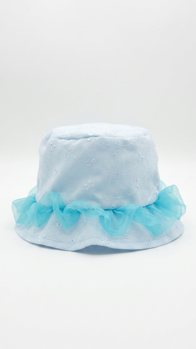 Light blue bucket hat with ruffled trim on a white background
