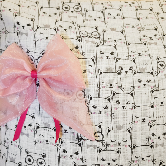 pillowcase close up look with pink bow and cute cat fabric